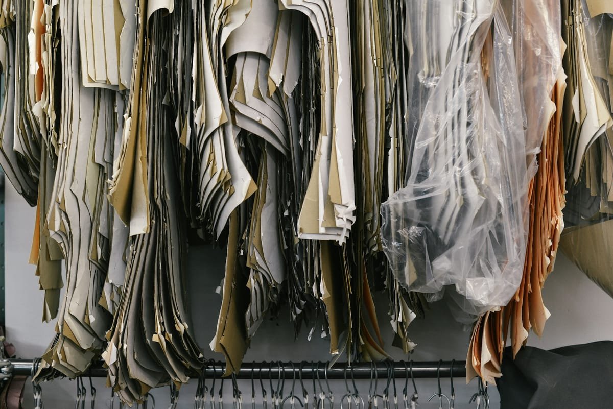 Leather pattern templates hanging in the workshop